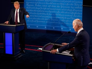 caption: In this file image, then-President Donald Trump and then-former Vice President and Democratic presidential nominee Joe Biden speak during the first presidential debate on September 29, 2020 in Cleveland, Ohio.