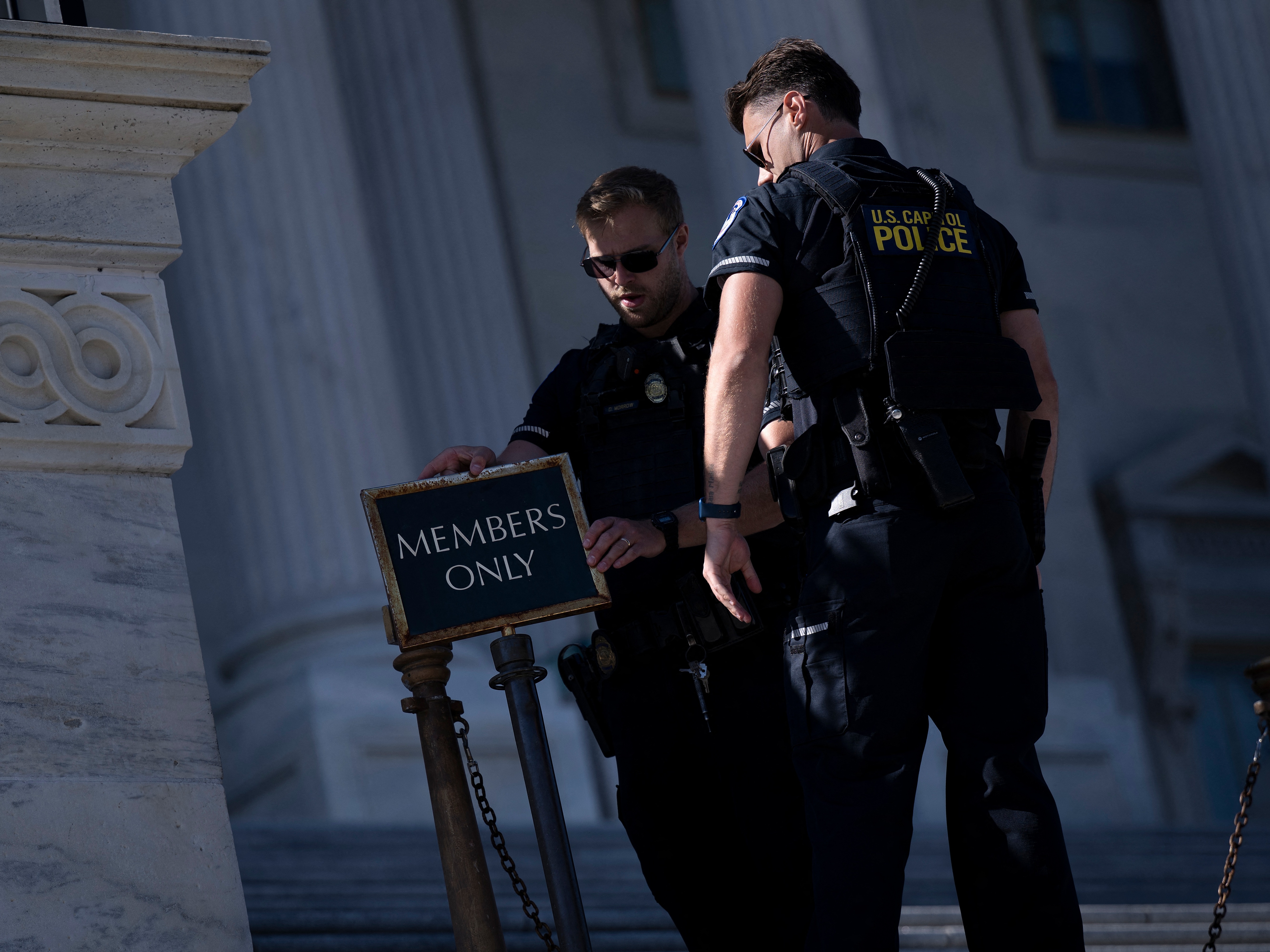 caption: U.S. Capitol Police close an entrance to the Capitol as the federal government continued its shutdown on Oct. 9. Because of the shutdown, officers missed their first full paycheck Oct. 10.