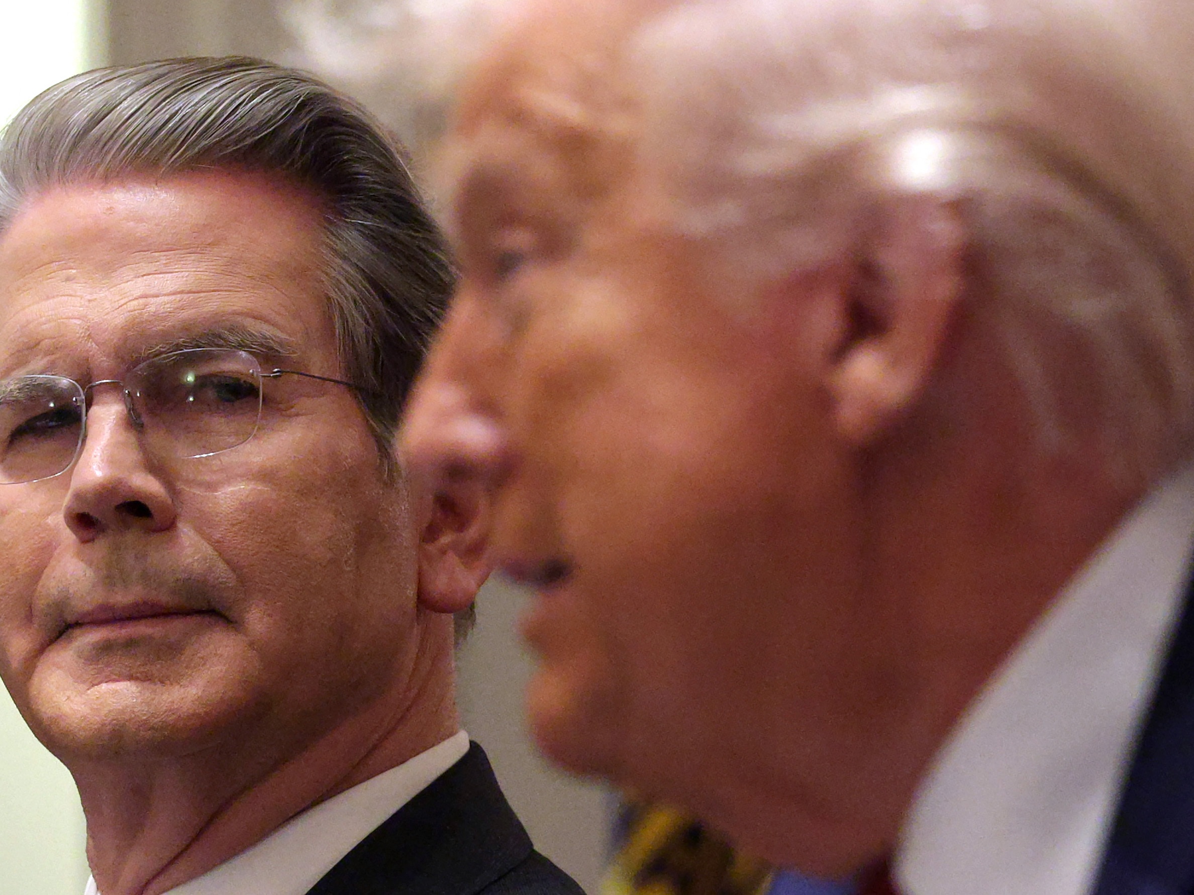 caption: The U.S. Mint, overseen by Treasury Secretary Scott Bessent (left), rolled out designs for new coins marking the United States' 250th birthday. In some cases, the recommendations from a citizens advisory committee were rejected.