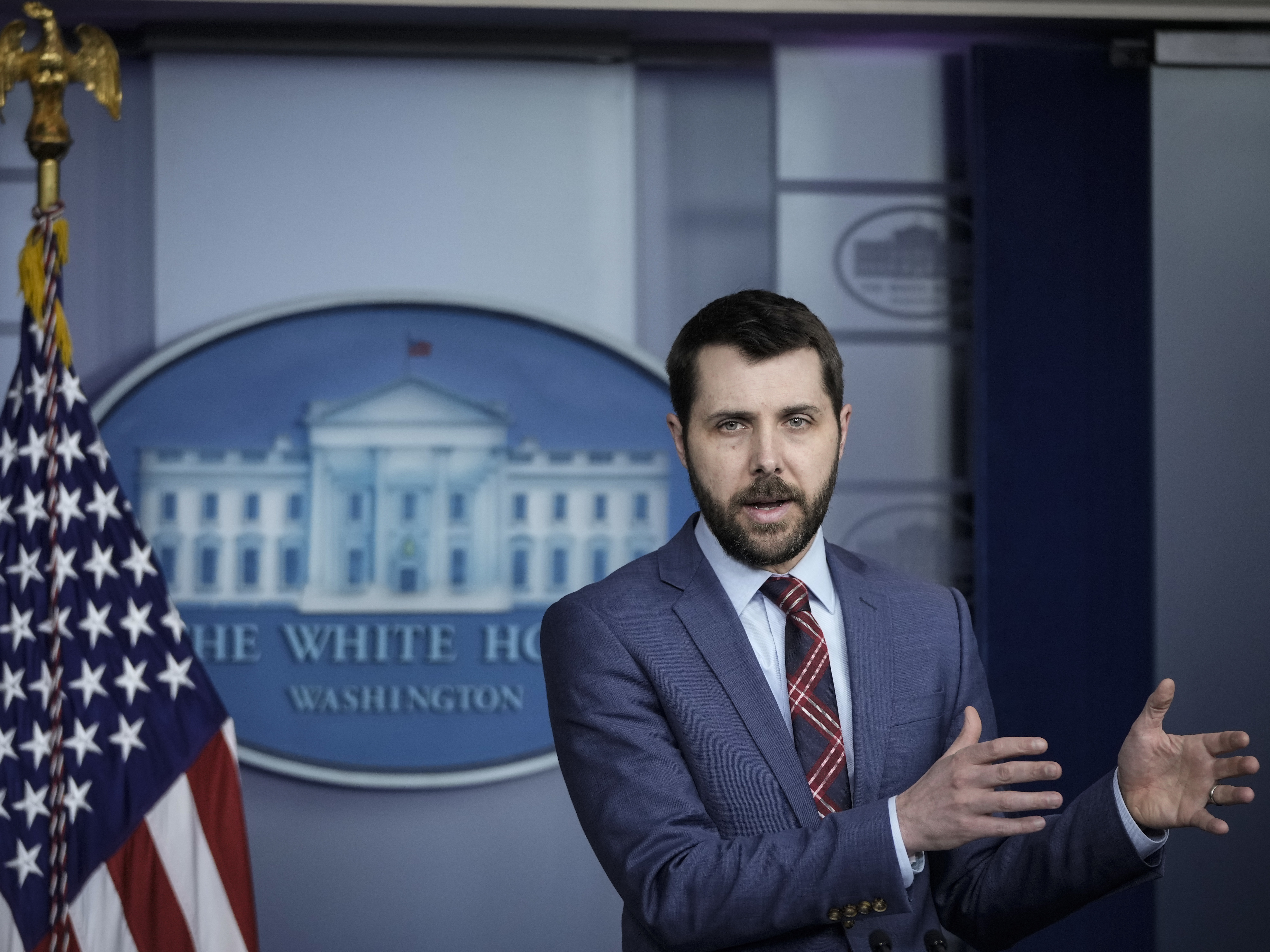 caption: Brian Deese, director of the White House National Economic Council, speaks to reporters at the White House about the American Families Plan.