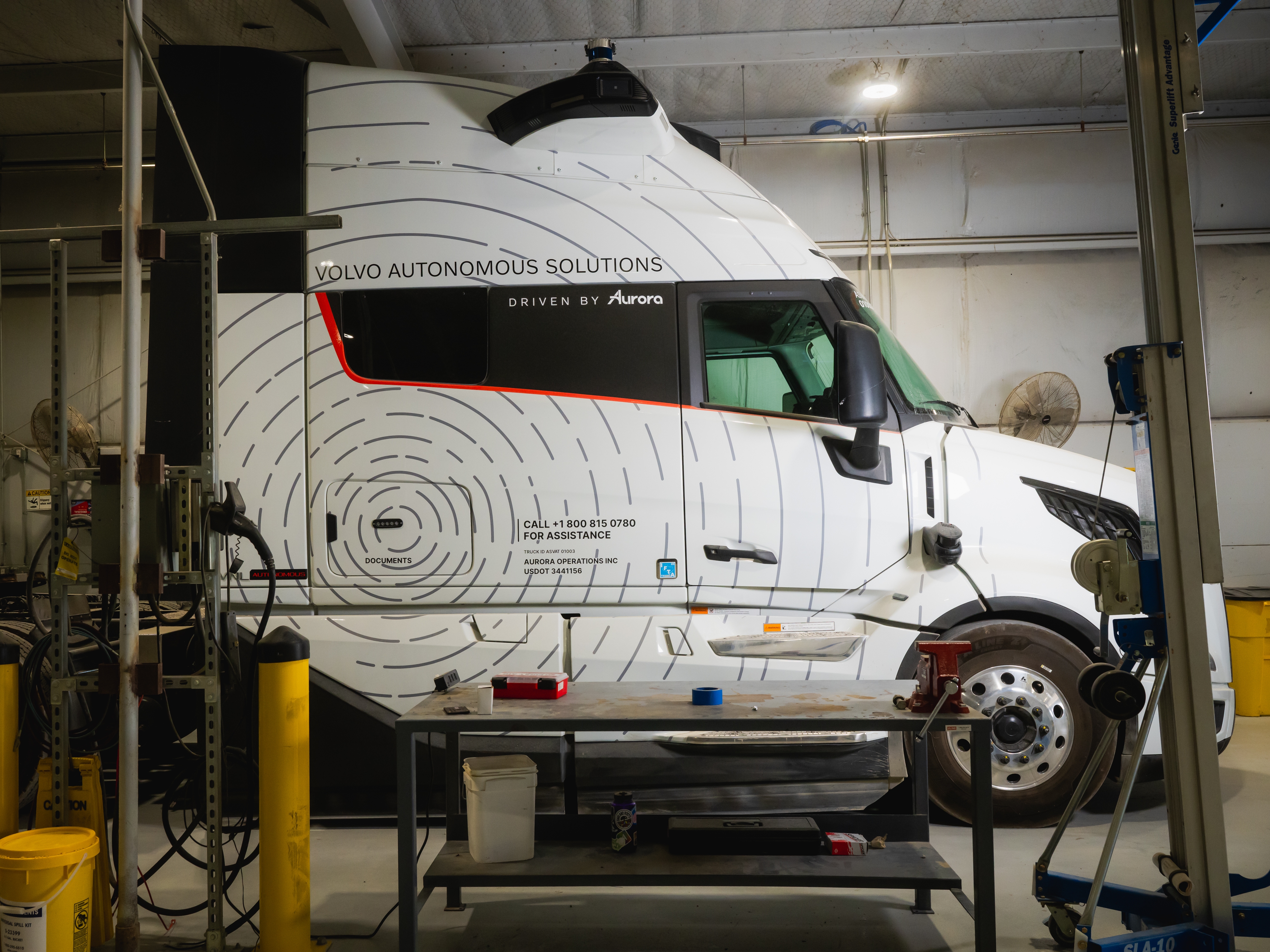 caption: A Volvo Autonomous Solutions truck is seen at Aurora South Dallas Terminal in Palmer, Texas.