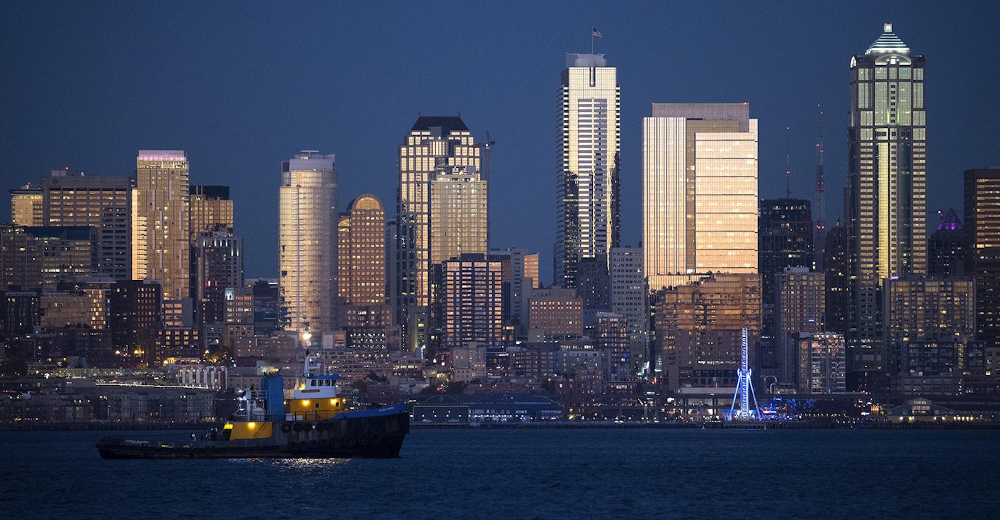 caption: The sun sets on downtown Seattle on Friday, October 27, 2017, shown from Harbor Ave. Southwest.