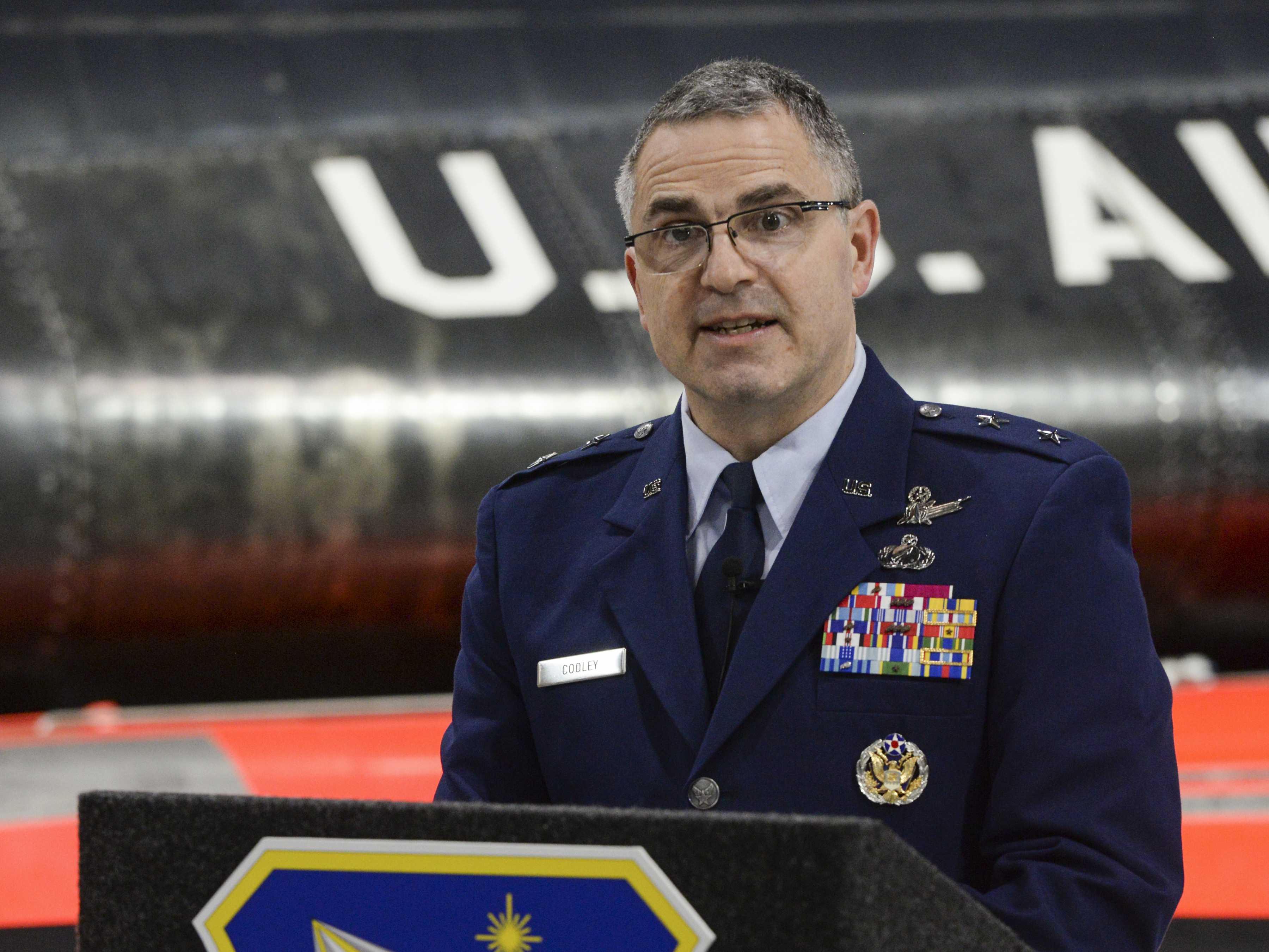 caption: U.S. Air Force Maj. Gen. William T. Cooley speaks during a press conference inside the National Museum of the United States Air Force on Wright-Patterson Air Force Base in 2019.