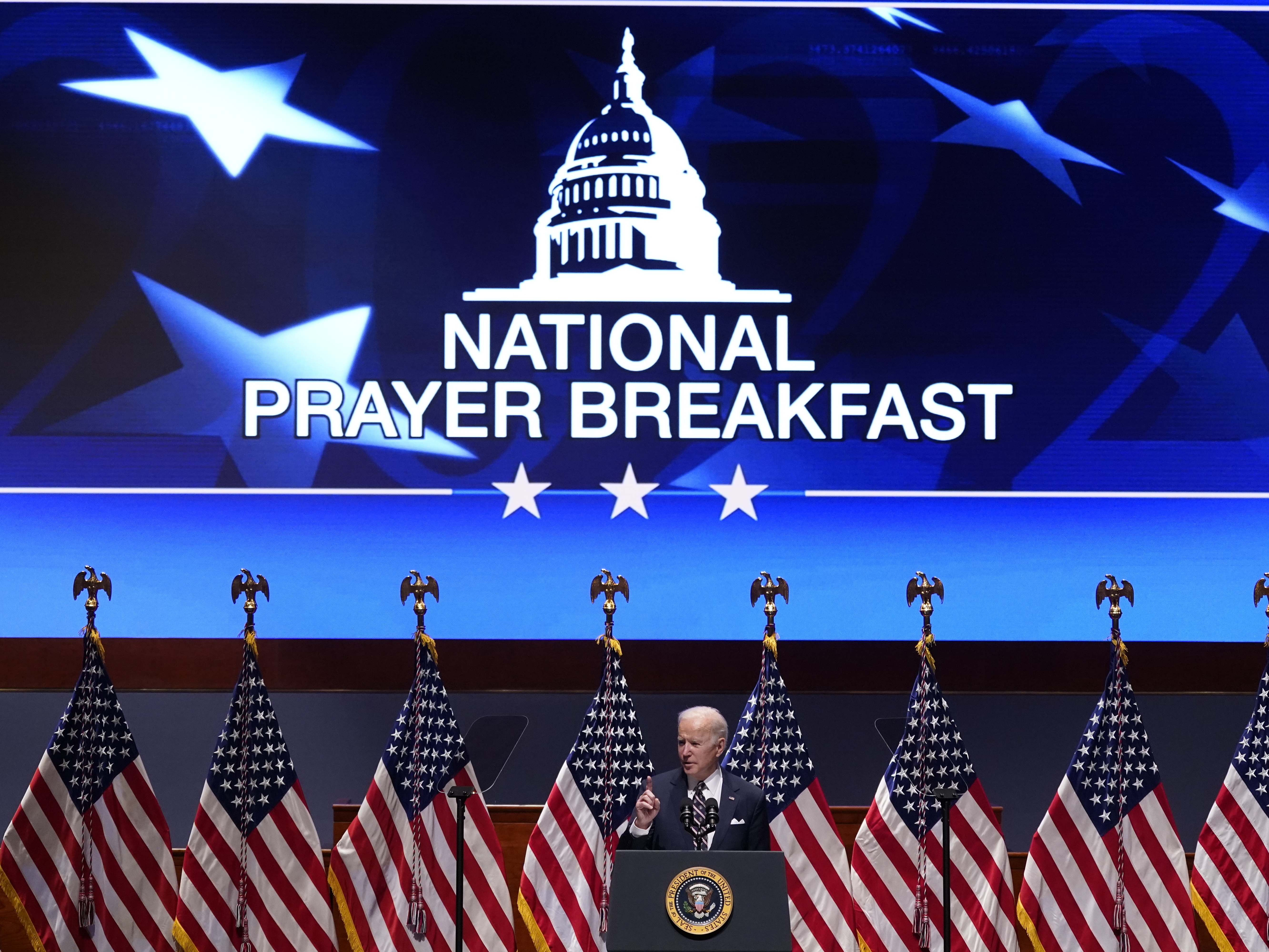 caption: President Joe Biden speaks at the National Prayer Breakfast, Thursday, Feb. 3, 2022, on Capitol Hill in Washington.