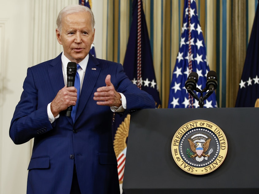 caption: President Biden takes questions from reporters at the White House on Wednesday.