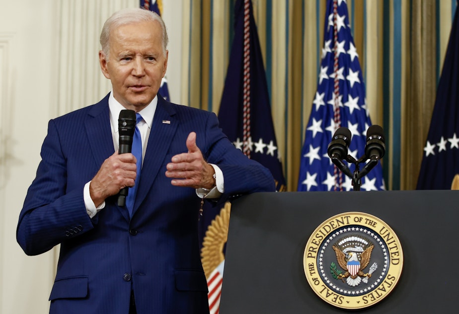 caption: President Biden takes questions from reporters at the White House on Wednesday.