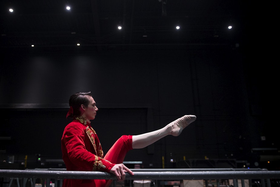 caption: Corps de ballet dancer Mark Cuddihee warms up backstage before performing in the second act of Cinderella on Saturday, February 1, 2020, at McCaw Hall in Seattle. 