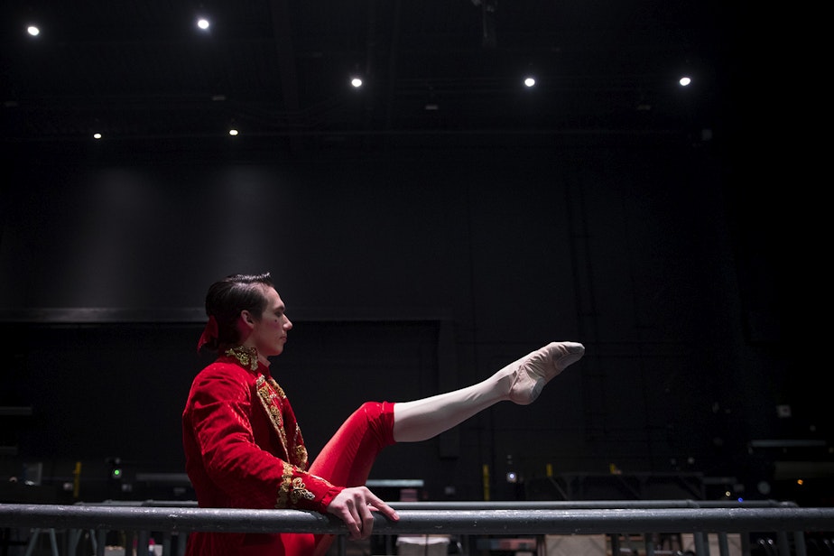 caption: Corps de ballet dancer Mark Cuddihee warms up backstage before performing in the second act of Cinderella on Saturday, February 1, 2020, at McCaw Hall in Seattle.