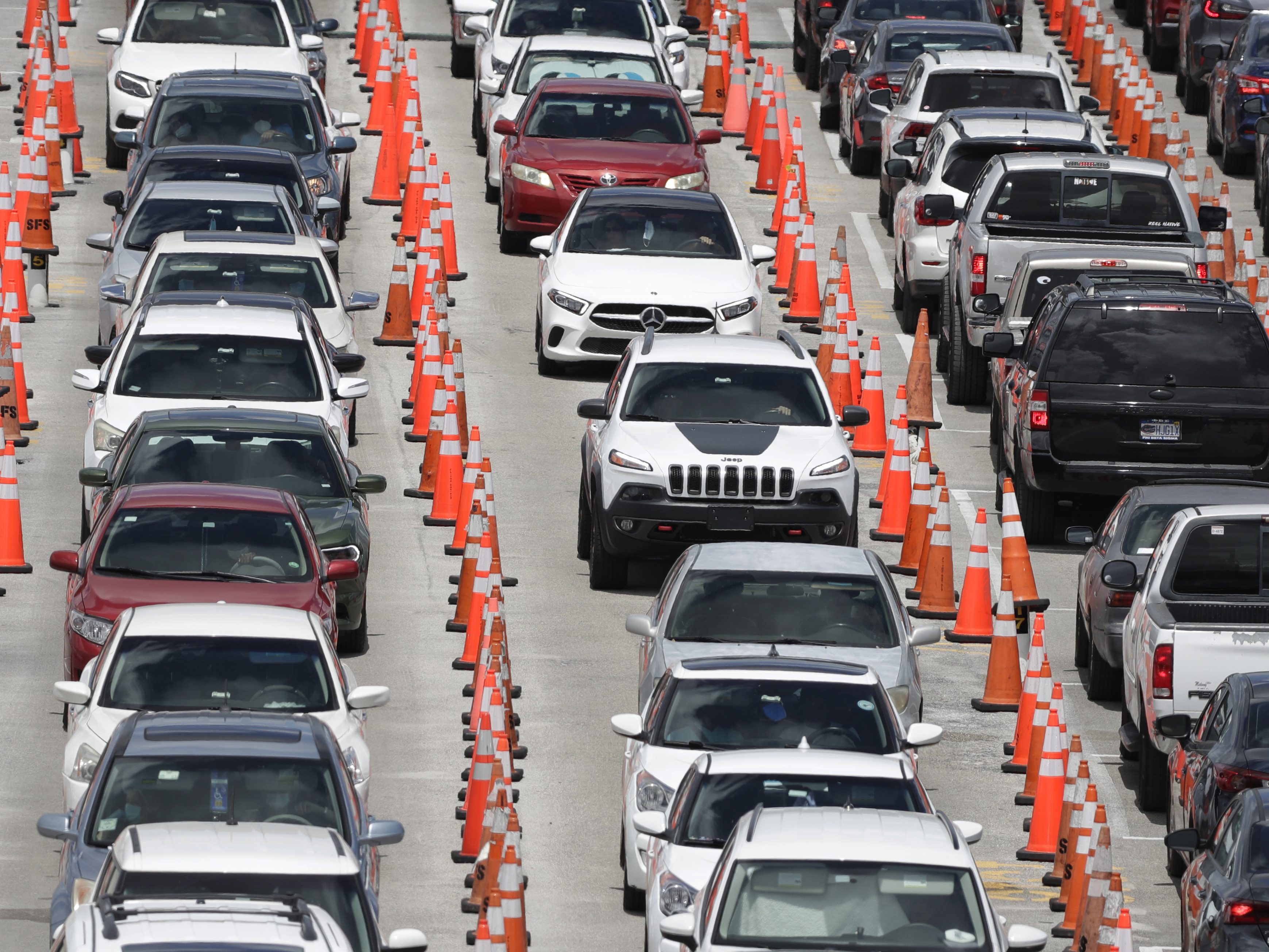 caption: Cars line up for coronavirus testing outside Hard Rock Stadium in Miami Gardens, Fla. Florida is one of many states reporting spikes in COVID-19 cases in recent days, as the number of confirmed cases worldwide has topped 10 million.