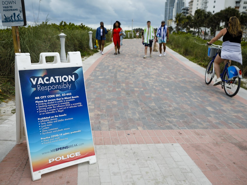 caption: Even with some colleges canceling their midsemester breaks due to COVID-19, students from more than 200 schools are expected to visit Miami Beach during spring break, which runs until mid-April.