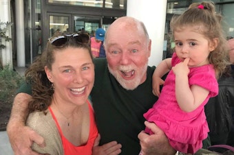 caption: Alicia Caton, left, with her father Larry, and daughter, Mia.