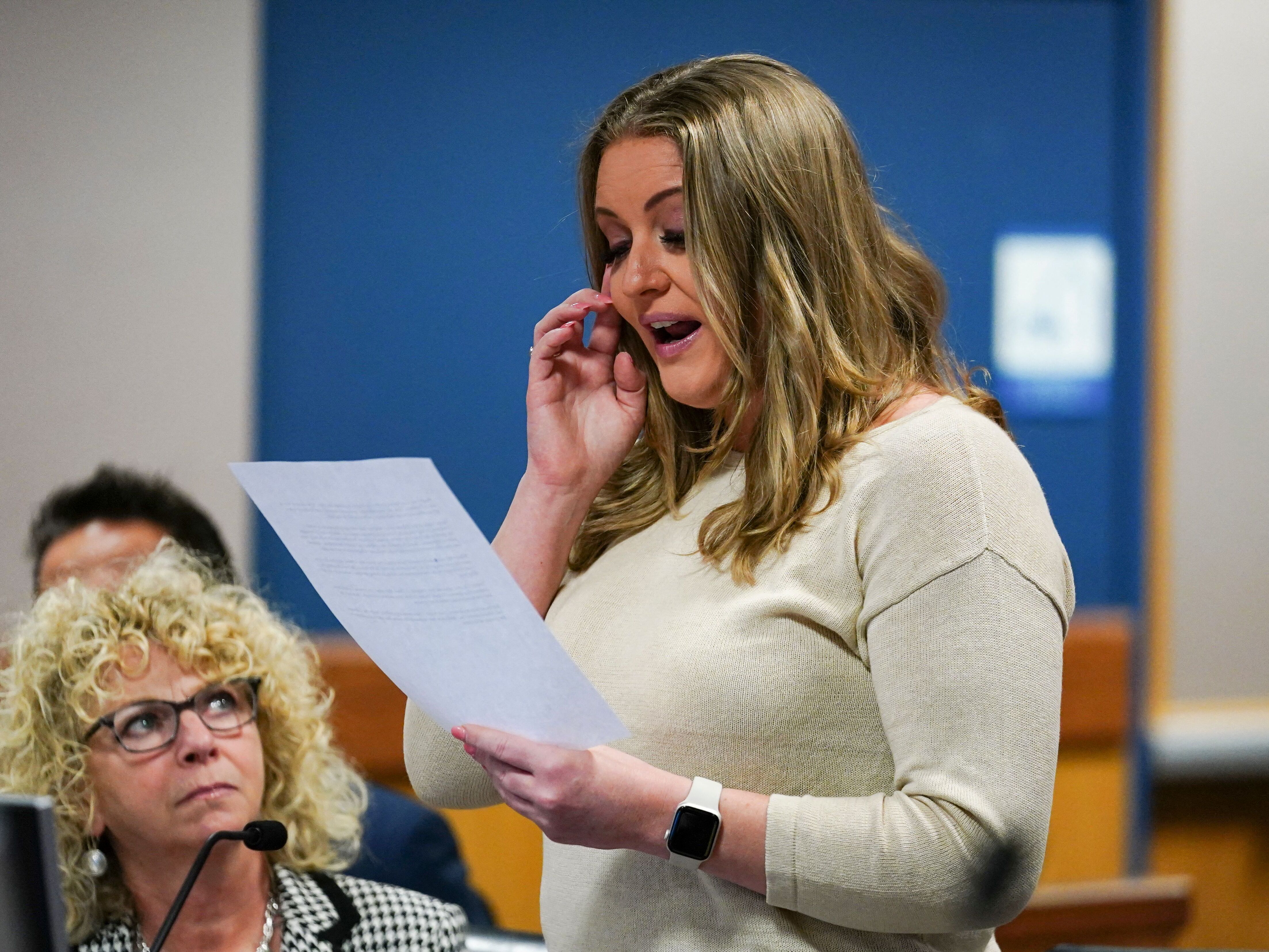 caption: Former Trump attorney Jenna Ellis reads a statement after pleading guilty in Atlanta on Oct. 24, 2023, to one felony count of aiding and abetting false statements and writings in the Fulton County election subversion case.