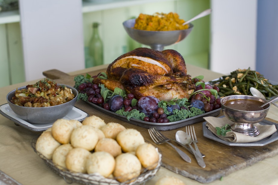 caption: This Oct. 17, 2011 photo shows a sweet and spicy turkey surrounded by, clockwise from top, smashed harvest vegetables, oven-candied green beans amandine, gravy, brown sugar and oatmeal rolls and candied bacon stuffing in Concord, N.H.  (AP Photo/Matthew Mead)