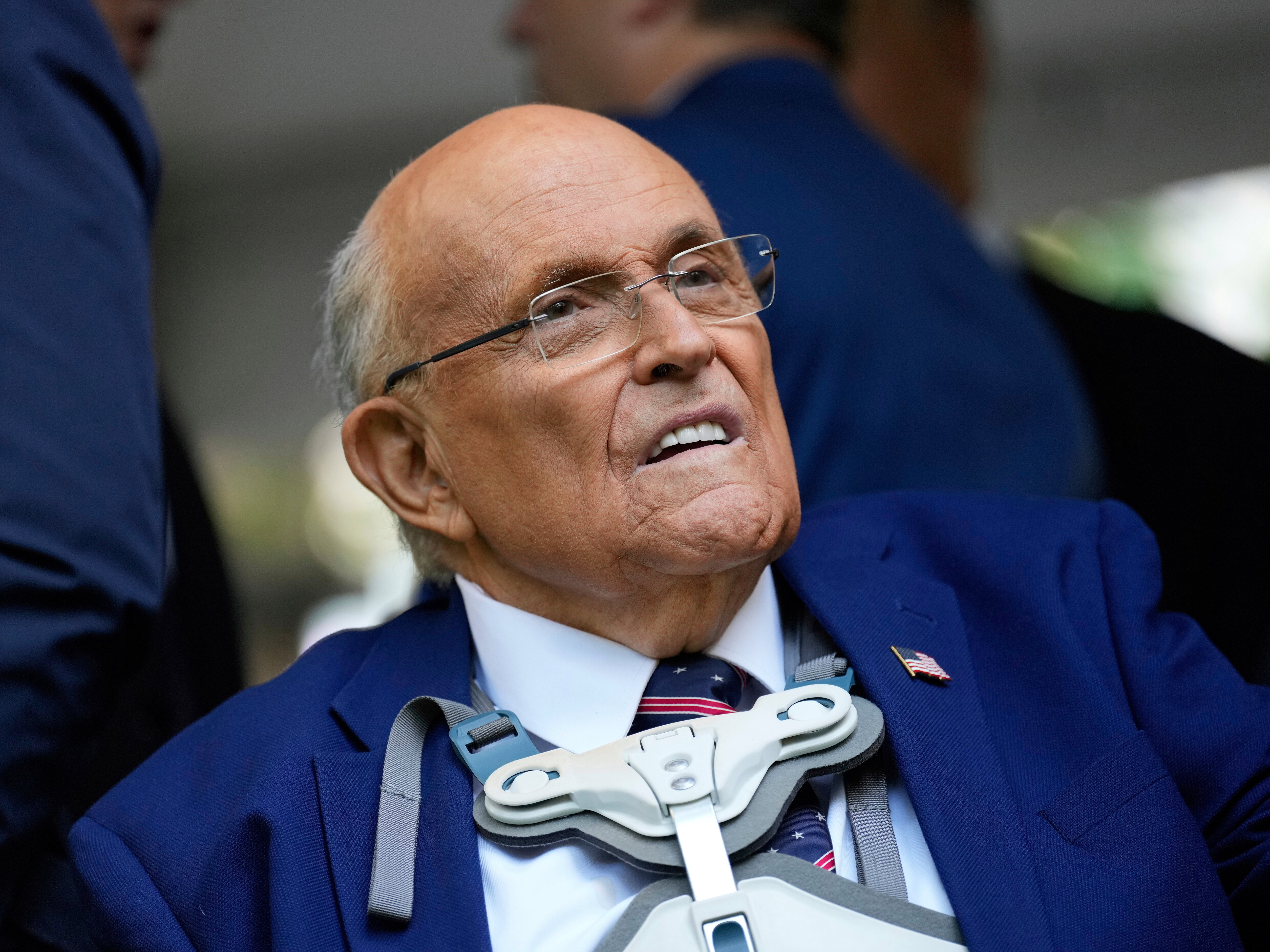 caption: FILE - Former NYC mayor Rudy Giuliani participates in a ceremony commemorating the anniversary of the 9-11 terror attacks in New York, Thursday, Sept. 11, 2025.