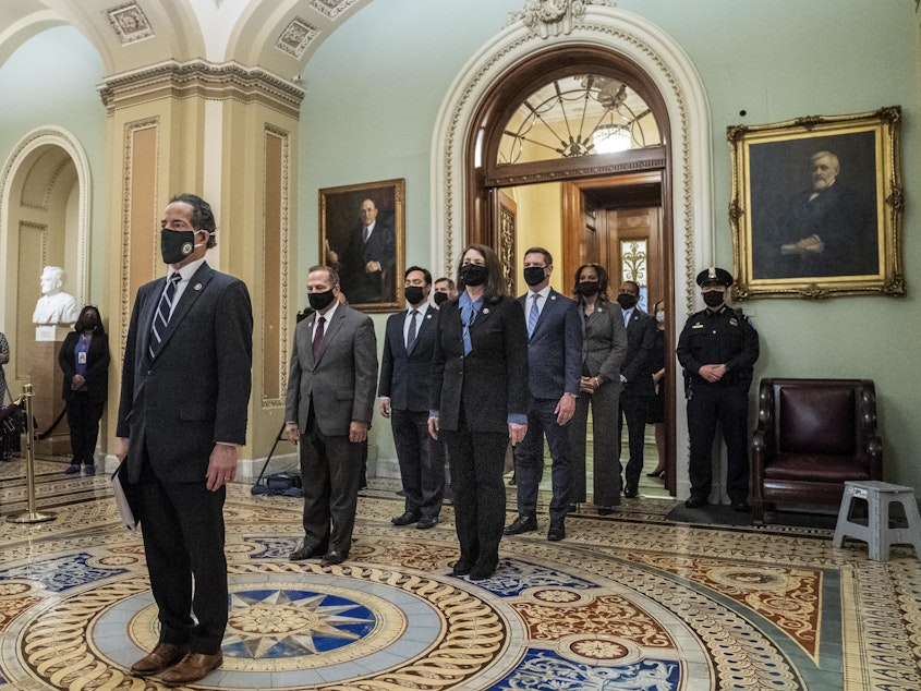 caption: House impeachment managers, led by Rep. Jamie Raskin, D-Md., seen leaving the Senate floor after delivering the article of impeachment on Capitol Hill on Jan. 25. They will deliver the case against former President Trump starting Tuesday.