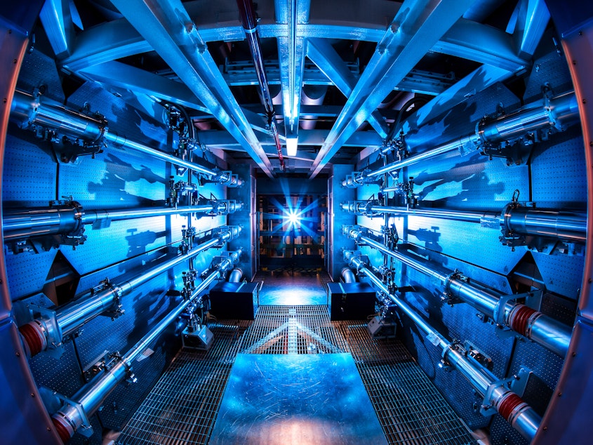 caption: The multi-billion dollar National Ignition Facility has used 192 laser beams to create net energy from a tiny pellet of nuclear fuel.