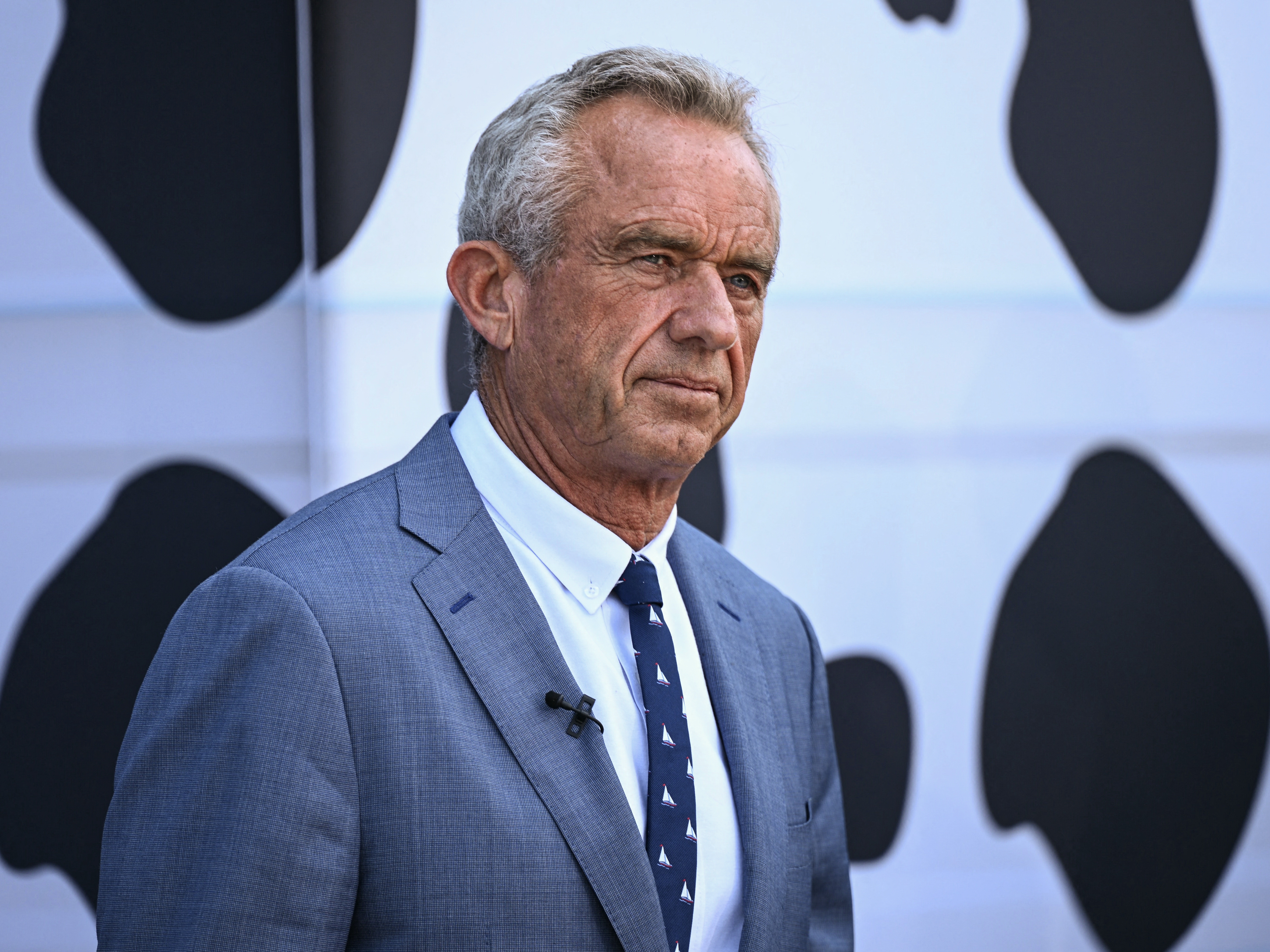 caption: Secretary of Health and Human Services Robert F. Kennedy Jr. looks on during a news conference at the USDA headquarters in Washington, D.C., on July 14. Top medical groups are alarmed by a report that Kennedy may remove another advisory panel.