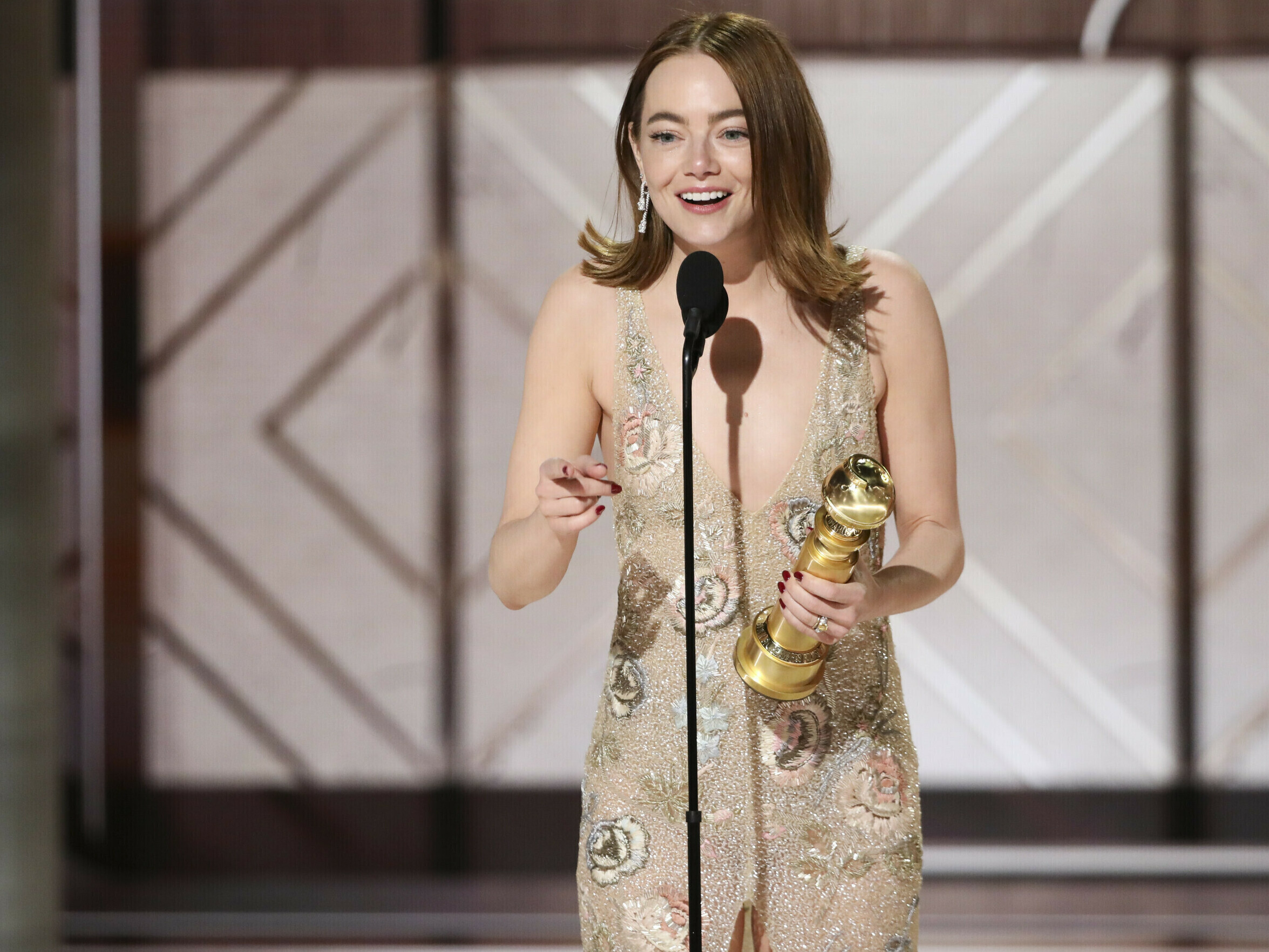 caption: This image released by CBS shows Emma Stone accepting the award for best female actor in a motion picture for her role in "Poor Things" during the 81st Annual Golden Globe Awards in Beverly Hills, Calif., on Sunday, Jan. 7, 2024.