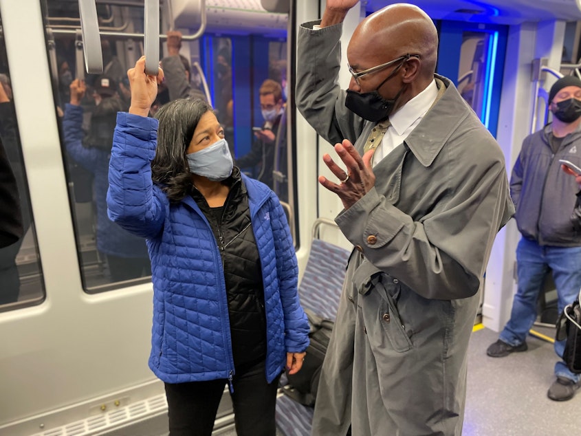 caption: Representative Jayapal speaks with Sound Transit official Ron Lewis, head of Design, Engineering & Construction Management