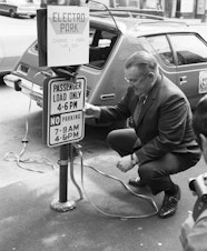 caption: City Light Superintendent Gordon Vickery with a prototype AMC Gremlin electric car, 1973
