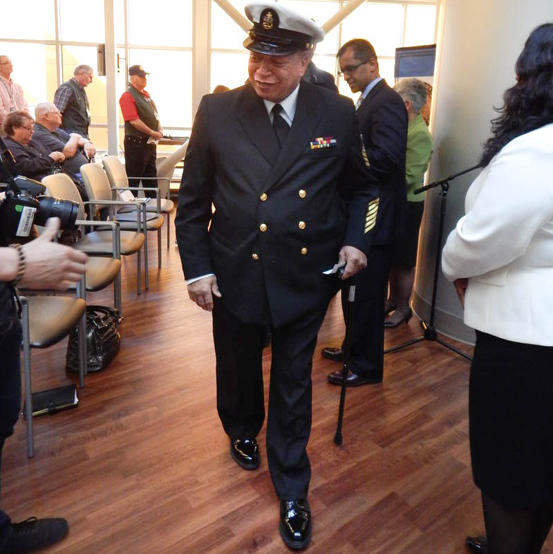 caption: Roosevelt Ward Jr. after receiving a 50th anniversary commemorative pin. Ward served in the US Navy between 1965-1966.