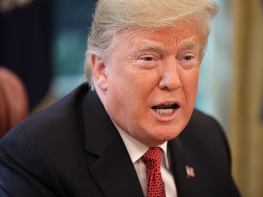 caption: If Saudi Arabia is responsible for a Saudi journalist's disappearance, the consequences will be "very severe," President Trump told <em>The New York Times.</em>