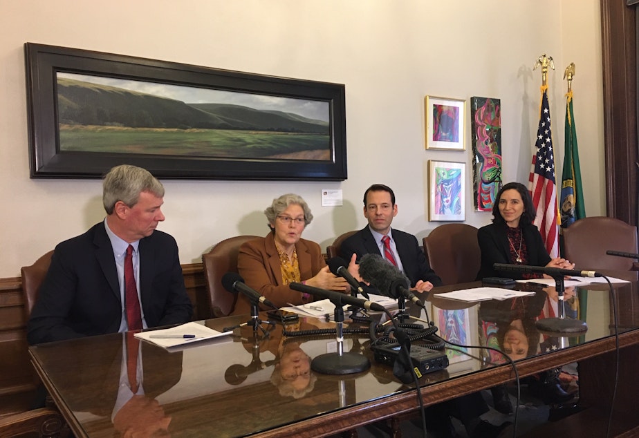 caption: Speaker of the House Laurie Jinkins, second from left, says banning so-called 'assault weapons' is complicated because of definitions. 