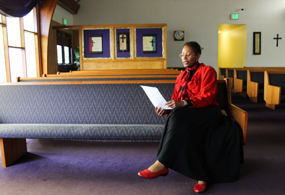 caption: Karen Shiveley, 67, waits to meet the pastor of a Baptist church in Everett. Shiveley has been checking out several churches around the Seattle area, hoping to find the right fit.