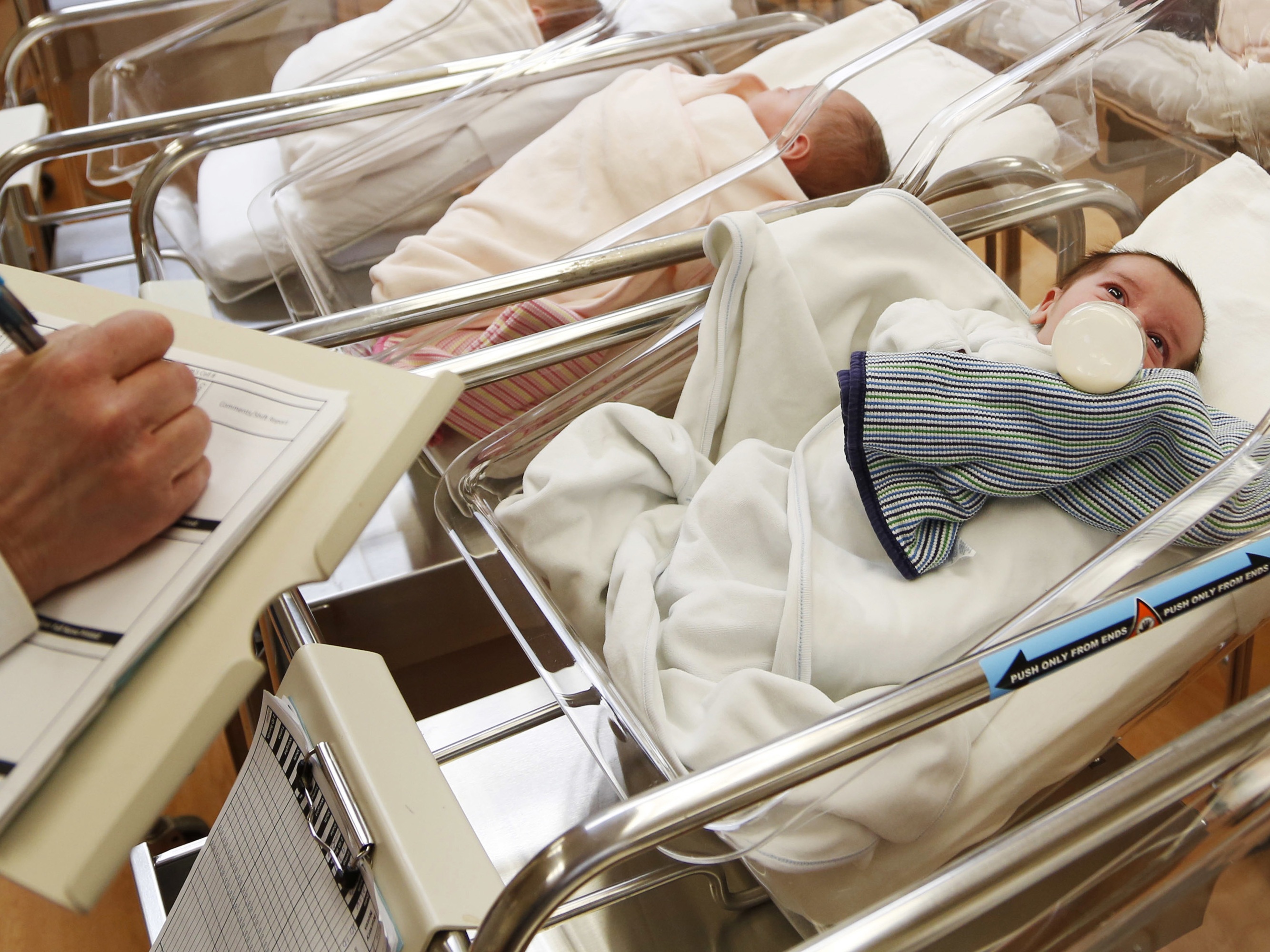caption: Newborn babies lie in bassinets in the nursery of a postpartum recovery center in upstate New York in 2017. A new study examined births over decades to find tendencies toward having all girls or all boys.