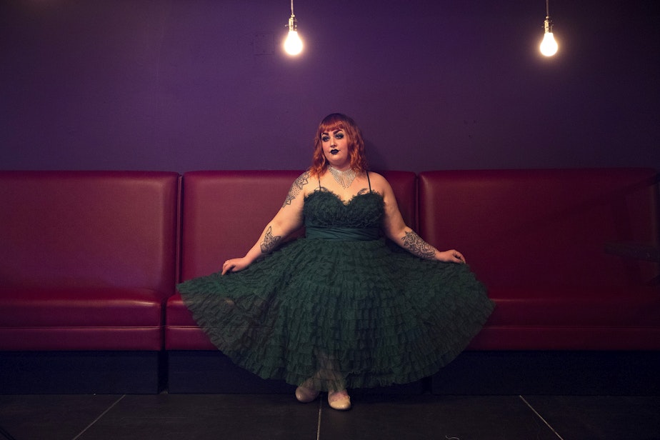 caption: Burlesque performer Penny Banks poses for a portrait on Friday, April 9, 2021, at the new Burlesque space along Northwest Market Street in Seattle.