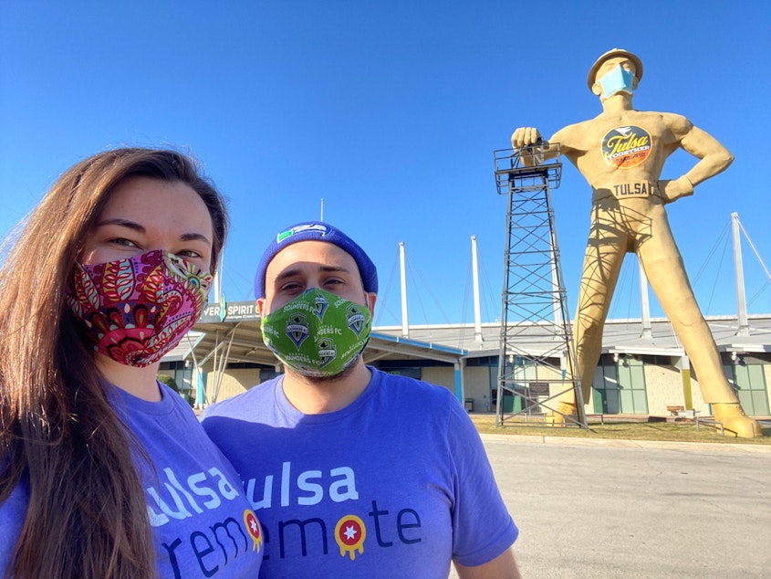 caption: Teddie Mucha and Tiago Duarte were enticed to give up on their dream of moving to Seattle in favor of working remotely in Tulsa, Oklahoma