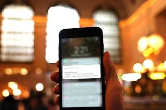 caption: A phone is seen in Grand Central Station in New York City on October 3, 2018, as it recieves an emergency test "Presidential alert" message. - The Federal Emergency Management Agency (FEMA) at 2:18 pm Eastern Time tested for the first time the nationwide Presidential Level Emergency Alert System (EAS), to include the Wireless Emergency Alerts (WEA) system.