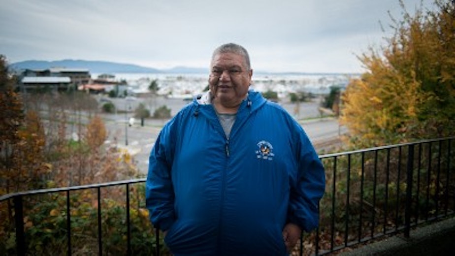 caption: Elden Hillaire overlooking the Squalicum Harbor Marina/Bellingham Harbor Marina, Bellingham, Washington.