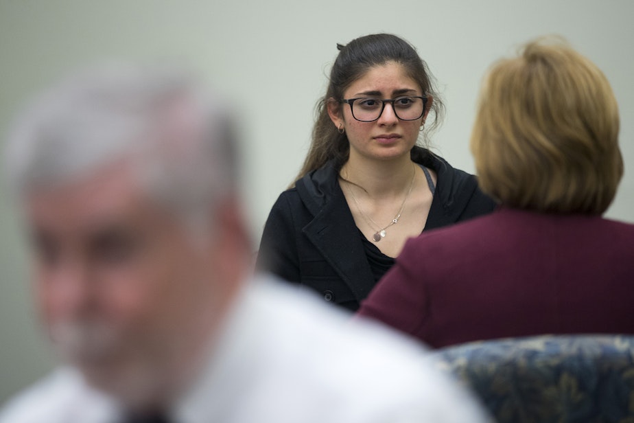 caption: High school student Olivia Poolos in conversation with Presiding Judge Laura Inveen. 
