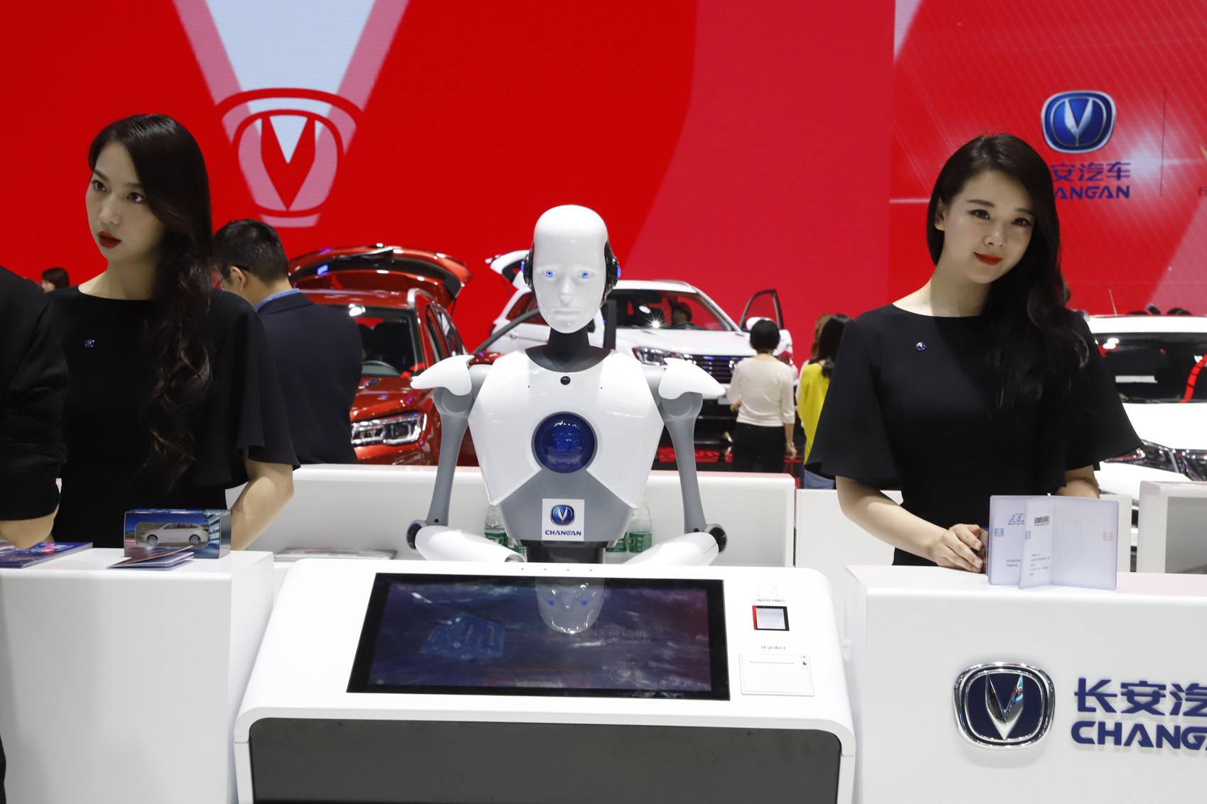 caption: FILE - In this April 26, 2018, file photo, a robot assist receptionist is seen at the booth of a Chinese automaker during the China Auto 2018 show in Beijing, China. Under President Xi Jinping, a program known as "Made in China 2025" aims to make China a tech superpower by advancing development of industries that in addition to semiconductors includes artificial intelligence, pharmaceuticals and electric vehicles. (AP Photo/Ng Han Guan, File)
