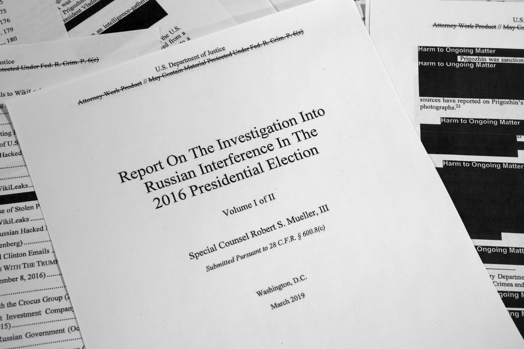 caption: Special counsel Robert Mueller's redacted report on Russian interference in the 2016 presidential election as released on Thursday, April 18, 2019, is photographed in Washington. (Jon Elswick/AP)