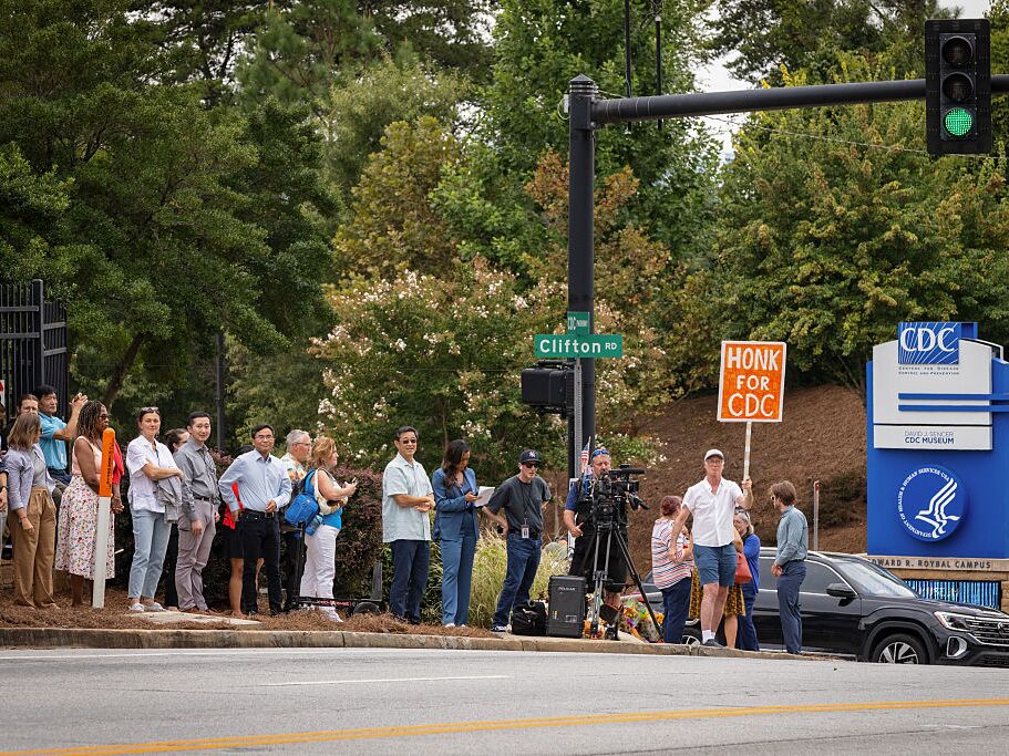 caption: Centers for Disease Control and Prevention staff and supporters protested cuts to the agency outside its headquarters in August. Over this past weekend, hundreds more employees were fired.