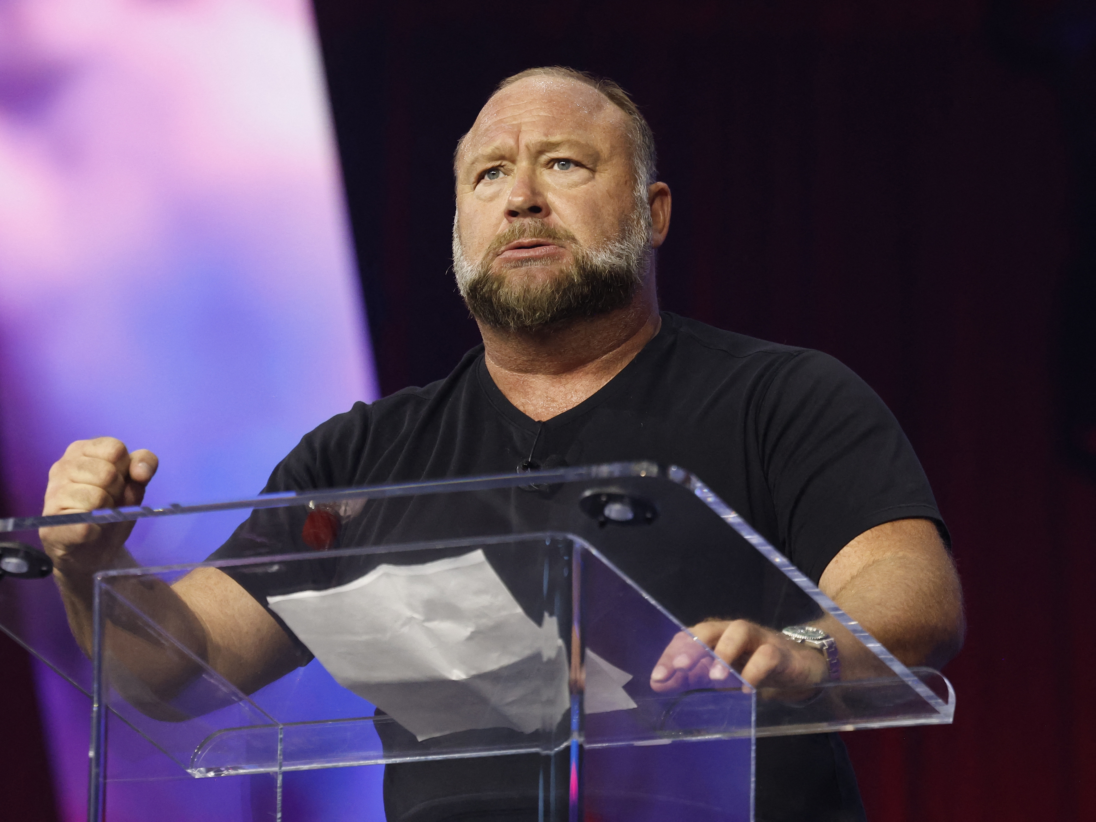 caption: Conspiracy theorist and Infowars host Alex Jones, pictured in June, says even if his show and its parent company, Free Speech Systems, are shut down as a result of the auction, he will not be silenced.