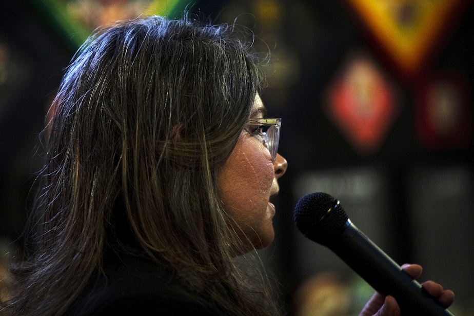 caption: Leslie Shore, head brewer at Pike Brewing Company, speaks to a crowd gathered to celebrate "Women in Beer," on Thursday, March 21, 2024, at the Pike Brewing Company in Seattle.  