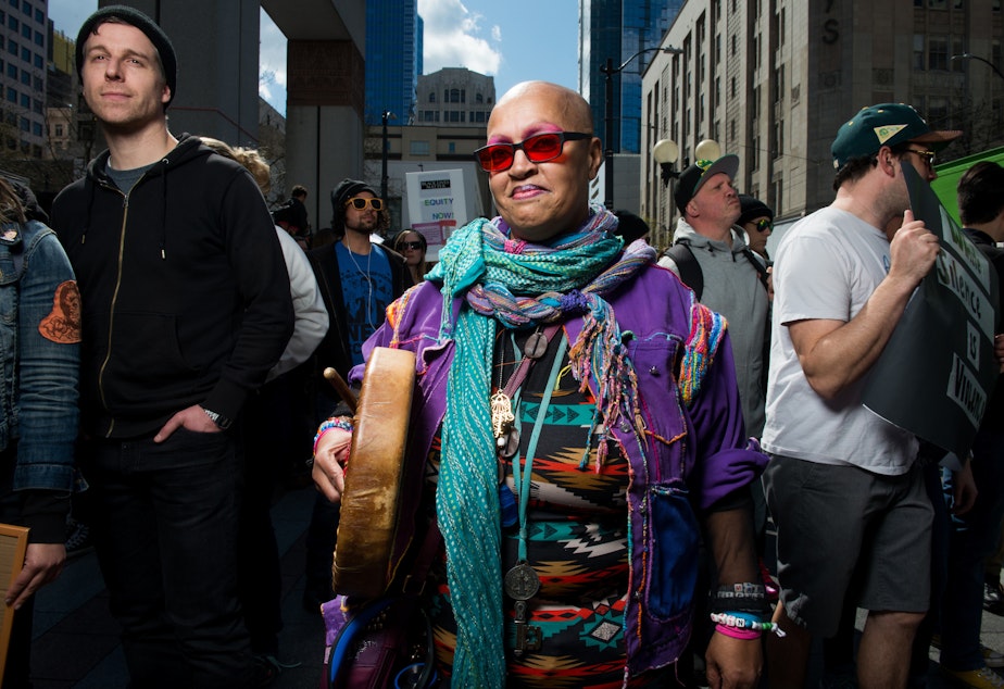 caption: 'If you feel it in your heart that means the drum is working,' said Mama Love, during a Black Lives Matter rally and march in Seattle Saturday April 15, 2017.