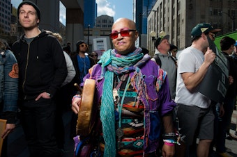 caption: 'If you feel it in your heart that means the drum is working,' said Mama Love, during a Black Lives Matter rally and march in Seattle Saturday April 15, 2017.