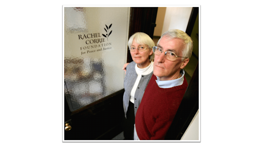 caption: Cindy and Craig Corrie stand outside the Rachel Corrie Foundation for Peace and Justice in Olympia.