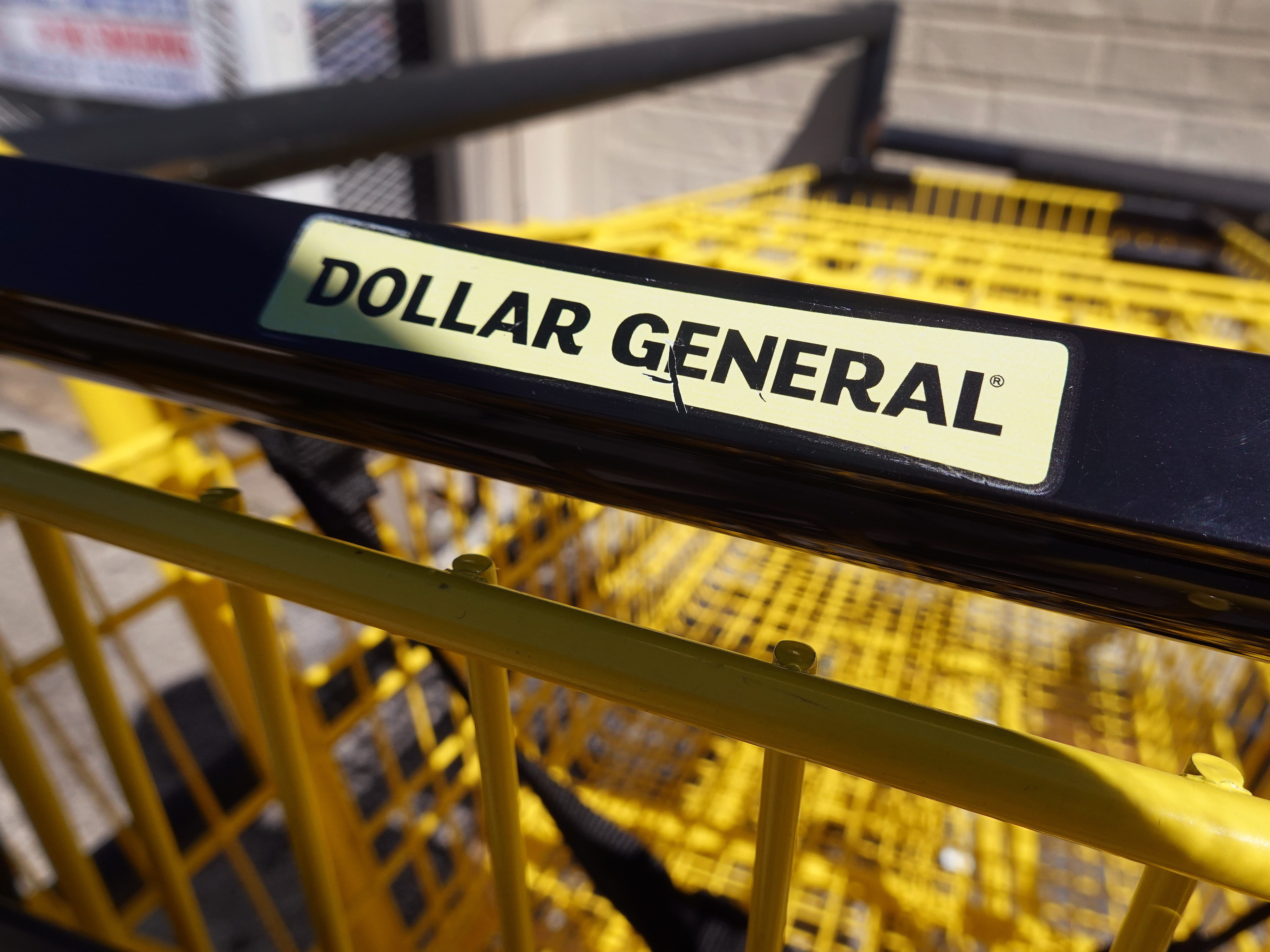 caption: Shopping carts sit outside of a Dollar General store in Chicago.