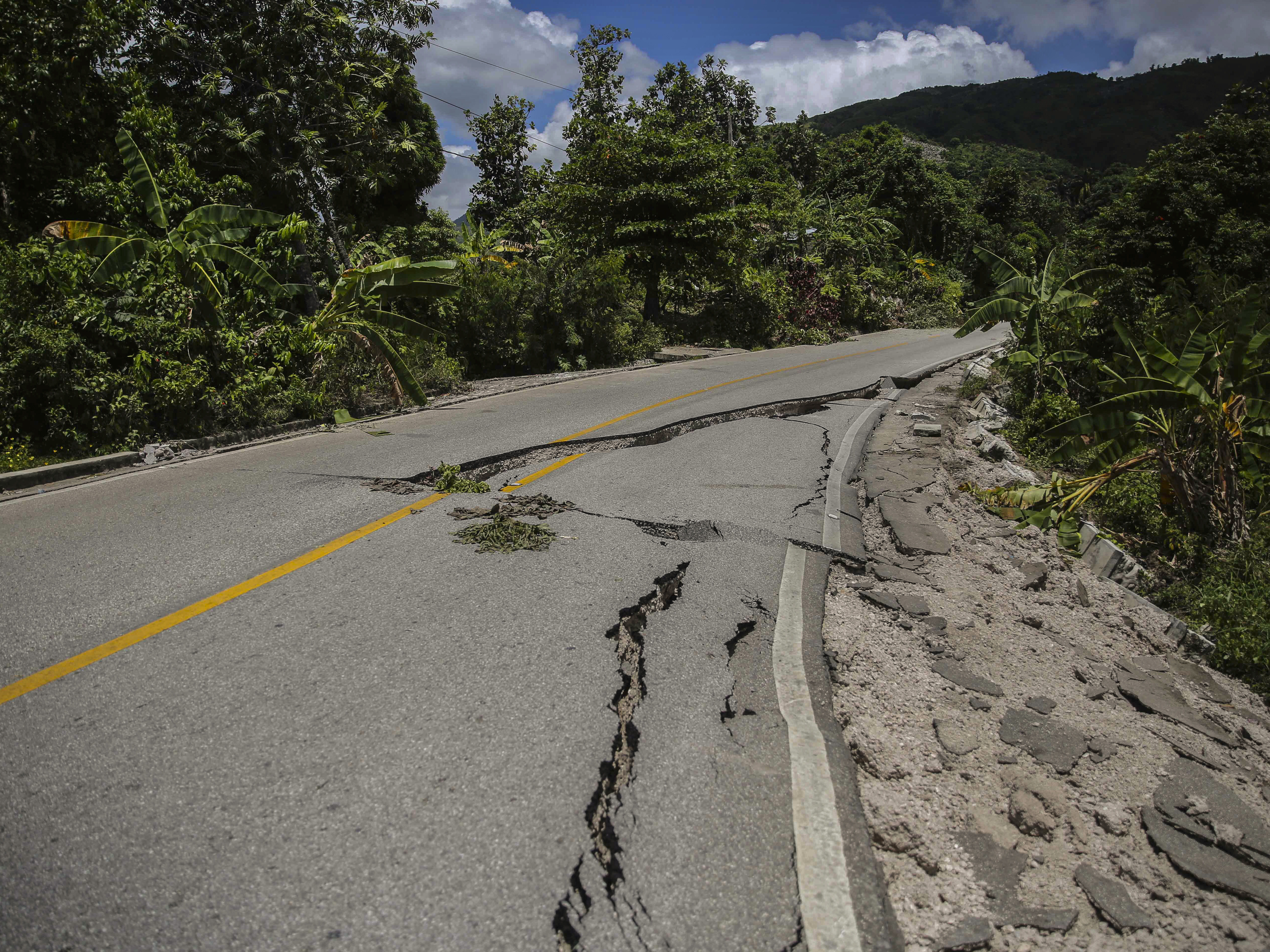 caption: A road is seen damaged by the earthquake in Camp-Perrin, Les Cayes, Haiti, Sunday, Aug. 15, 2021.