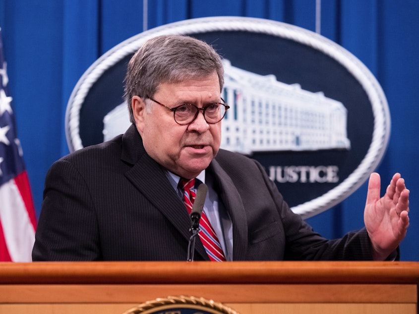 caption: Attorney General William Barr holds a news conference on Monday.