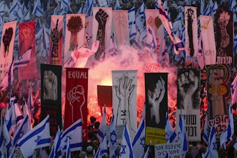 caption: Israelis protested against plans by Prime Minister Benjamin Netanyahu's government to overhaul the judicial system and in support of the Supreme Court in Jerusalem on Monday, Sept. 11, 2023. (AP Photo/Ohad Zwigenberg)