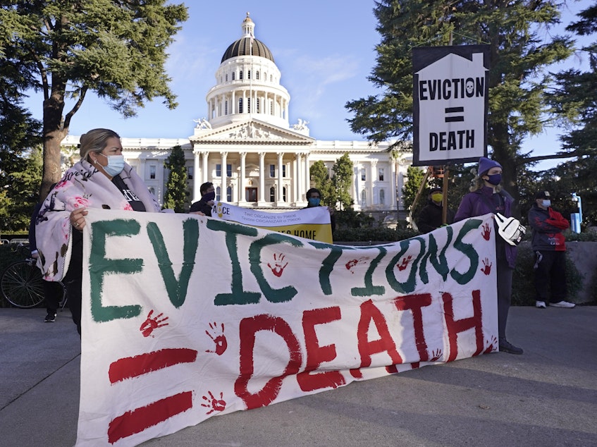 caption: Protesters call for stronger eviction protections in January in Sacramento, Calif. A federal appeals court will now decide whether to scrap a federal eviction moratorium from the CDC. Housing groups say renters need more time to qualify for and get rental assistance money.