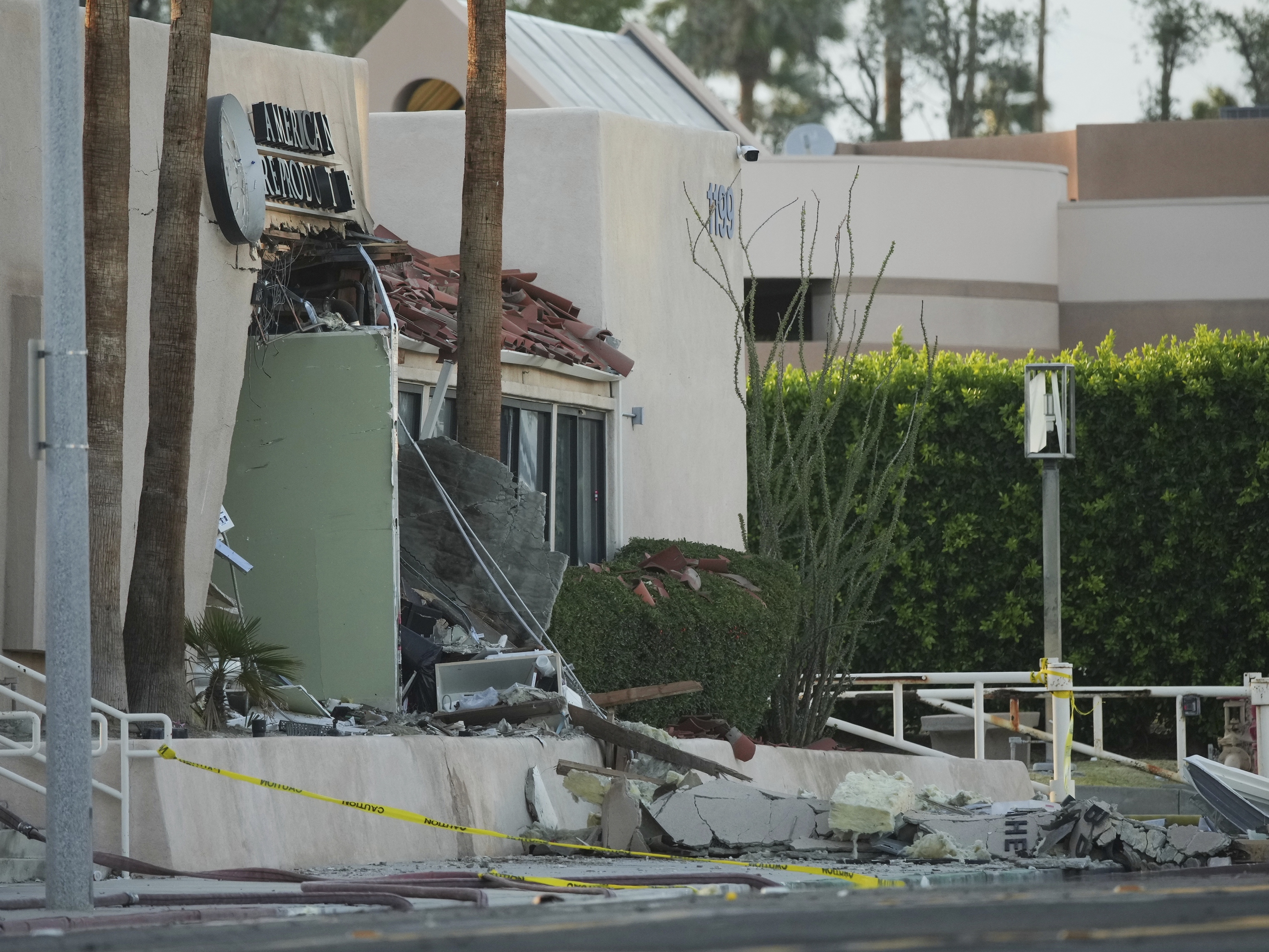 caption: A damaged building is seen after an explosion in Palm Springs, Calif., on Saturday.