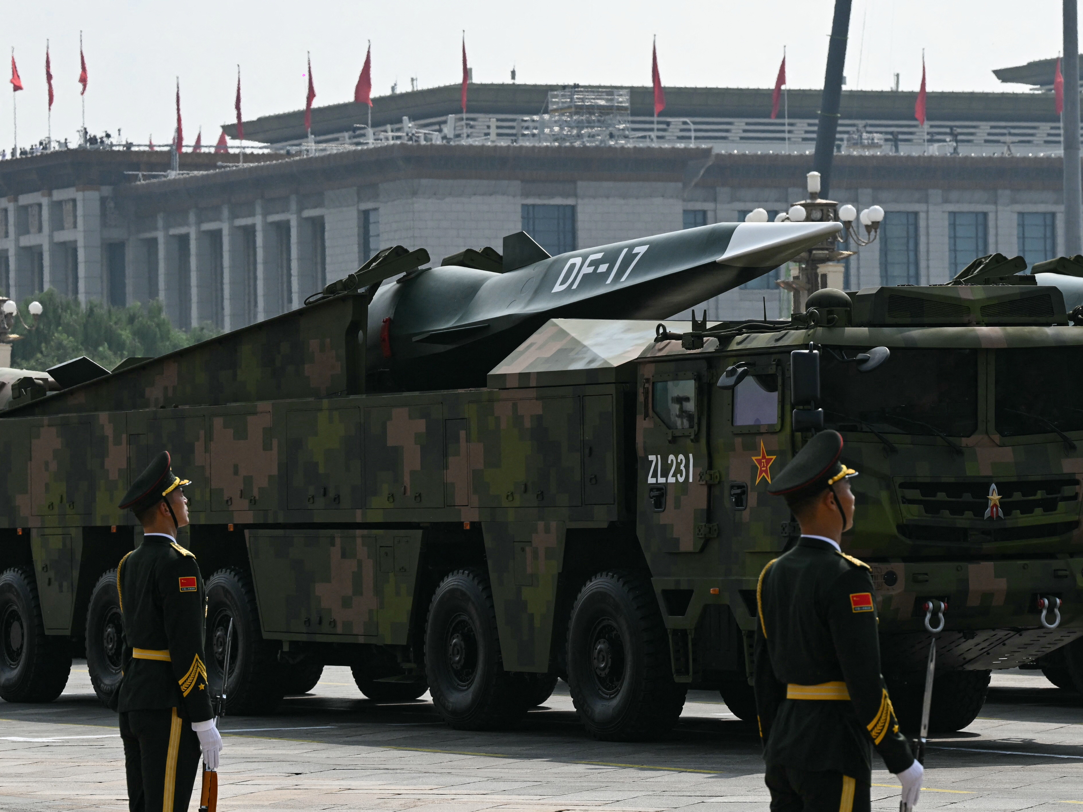 caption: A DF-17 road-mobile medium-range ballistic missile is seen during a military parade in Beijing's Tiananmen Square on September 3, 2025. China may want to develop new nuclear warheads for its hypersonic weapons.