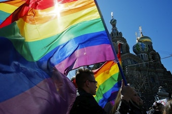 caption: Gay rights activists carry rainbow flags as they march during a May Day rally in 2013 in St. Petersburg, Russia. Russia's Supreme Court on Thursday effectively outlawed LGBTQ+ activism, in the most drastic step against advocates of gay, lesbian and transgender rights in the increasingly conservative country.